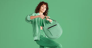 Botkier on qvc cover image featuring the beatrice saddle in clover