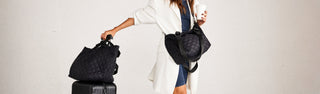 model with the carlisle mini tote and large tote in black